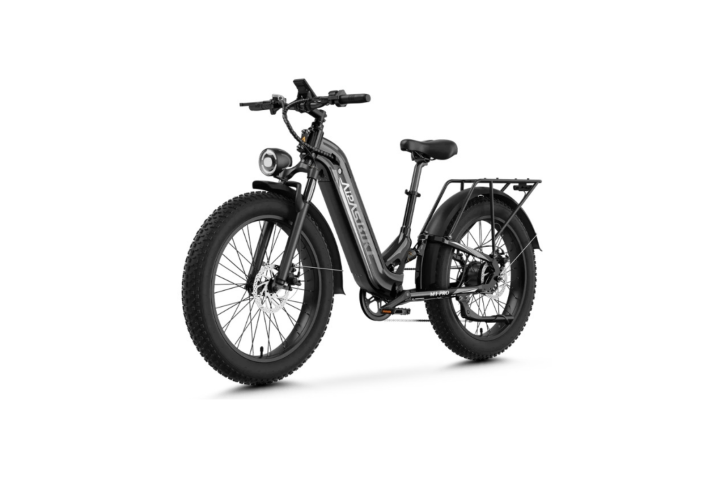 Black electric bicycle with thick tires and a rear cargo rack.